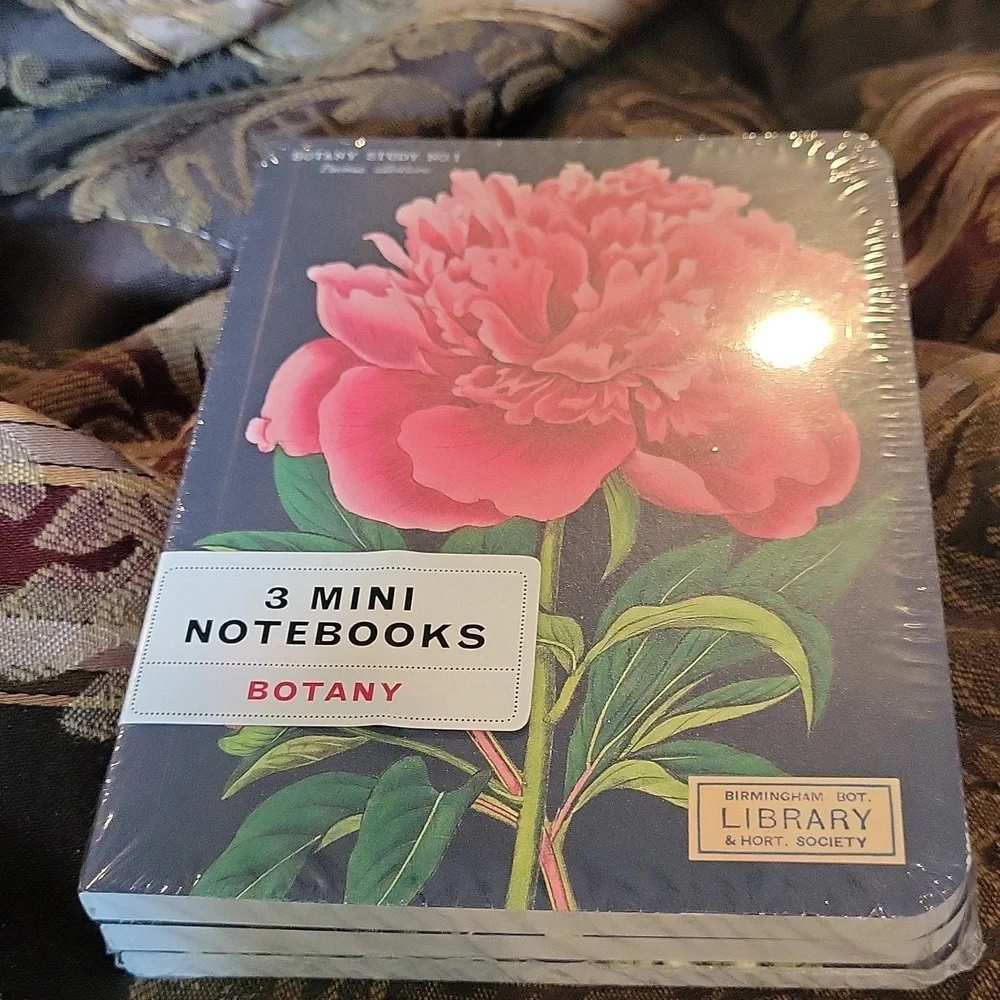 - Three mini  duo notebooks wrapped floral motif free pen fits any bag etc…